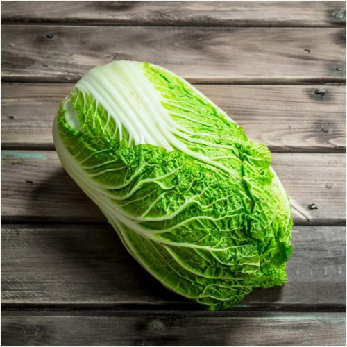 fresh salad chinees cabbage piece on wood table